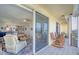 Balcony with rocking chairs overlooking the living room with a view at 7872 Sailboat Key S Blvd # 306, South Pasadena, FL 33707