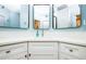 Modern bathroom with a corner vanity, ample storage, and contemporary mirrors at 7872 Sailboat Key S Blvd # 306, South Pasadena, FL 33707