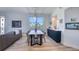 Spacious dining area with a marble table, blue cabinets, and ample natural light at 7872 Sailboat Key S Blvd # 306, South Pasadena, FL 33707