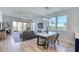 Elegant dining room with a modern chandelier, stylish seating, and scenic views at 7872 Sailboat Key S Blvd # 306, South Pasadena, FL 33707
