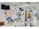 Exercise room with weight machines, tv, and other workout equipment at 7872 Sailboat Key S Blvd # 306, South Pasadena, FL 33707