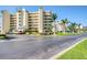 Attractive condominium complex featuring lush landscaping, well-maintained grounds, and convenient parking at 7872 Sailboat Key S Blvd # 306, South Pasadena, FL 33707