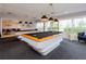 Game room with pool tables, lighting fixtures, neutral wall colors, and a view of the outdoors at 7872 Sailboat Key S Blvd # 306, South Pasadena, FL 33707