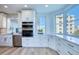 Updated kitchen featuring stainless steel appliances, white cabinetry, and bright windows offering beautiful views at 7872 Sailboat Key S Blvd # 306, South Pasadena, FL 33707