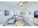 Open living space with dining area, a modern sofa, and stylish decor at 7872 Sailboat Key S Blvd # 306, South Pasadena, FL 33707