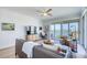 Relaxing living room with a comfortable sofa, balcony access, and scenic water views at 7872 Sailboat Key S Blvd # 306, South Pasadena, FL 33707