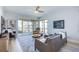 Inviting living room featuring plush seating and a balcony with beautiful views at 7872 Sailboat Key S Blvd # 306, South Pasadena, FL 33707