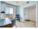 Bright living room with balcony access, a cozy sitting chair and a lovely view at 7872 Sailboat Key S Blvd # 306, South Pasadena, FL 33707