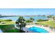 Inviting outdoor swimming pool surrounded by lush landscaping and serene water views, perfect for relaxation at 7872 Sailboat Key S Blvd # 306, South Pasadena, FL 33707