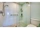Contemporary shower with tiled walls, glass door, and a shower head at 7872 Sailboat Key S Blvd # 306, South Pasadena, FL 33707
