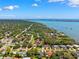 Stunning aerial view showcases a vibrant coastal community surrounded by sparkling waters and lush greenery at 8231 31St N Ter, St Petersburg, FL 33710