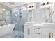 Luxurious bathroom with a freestanding tub, glass-enclosed shower, and double vanity at 8231 31St N Ter, St Petersburg, FL 33710