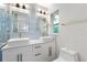 Elegant bathroom featuring a double sink vanity with gold fixtures and ample lighting at 8231 31St N Ter, St Petersburg, FL 33710