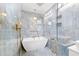 Stylish bathroom featuring a modern soaking tub and luxurious blue tiling at 8231 31St N Ter, St Petersburg, FL 33710