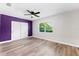 Inviting bedroom with stylish wood-look floors, a modern ceiling fan, and a view to the outdoors at 8231 31St N Ter, St Petersburg, FL 33710
