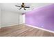 Spacious bedroom offering a ceiling fan, wood-look floors, and natural light through an outdoor-facing window at 8231 31St N Ter, St Petersburg, FL 33710