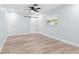 This light-filled bedroom boasts wood-look floors and a ceiling fan for ultimate comfort at 8231 31St N Ter, St Petersburg, FL 33710
