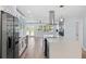 Kitchen features a large center island, stainless steel appliances, modern white cabinetry, and stylish countertops at 8231 31St N Ter, St Petersburg, FL 33710