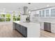 Bright kitchen features a large center island, stainless steel appliances, modern cabinetry, and stylish countertops at 8231 31St N Ter, St Petersburg, FL 33710