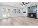 Spacious living room featuring new light wood floors, fireplace, and bright natural light at 8231 31St N Ter, St Petersburg, FL 33710