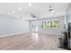 Bright living room with light wood floors, french doors, and large windows at 8231 31St N Ter, St Petersburg, FL 33710