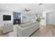 Bright living room with a decorative fireplace, light wood floors, and an open floor plan at 8231 31St N Ter, St Petersburg, FL 33710