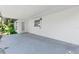 Covered patio features a white exterior, a multi-paned door, and a small window to provide natural light at 8231 31St N Ter, St Petersburg, FL 33710