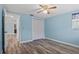 Cozy bedroom has new hardwood floors, closet, and abundant natural light at 8317 Needles Dr, Hudson, FL 34667