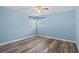 Comfortable bedroom features new hardwood floors and abundant natural light at 8317 Needles Dr, Hudson, FL 34667