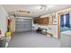 Spacious garage with laundry and storage; ready for vehicles and projects at 8317 Needles Dr, Hudson, FL 34667
