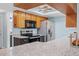 Updated kitchen features stainless steel appliances, granite countertops and stylish wood cabinetry at 8317 Needles Dr, Hudson, FL 34667