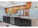 Updated kitchen features stainless appliances, granite countertops and modern cabinets at 8317 Needles Dr, Hudson, FL 34667