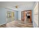 Bright living room has hardwood floors and easy access to the lanai and the kitchen at 8317 Needles Dr, Hudson, FL 34667