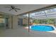 Inviting backyard pool area with a screened enclosure and ample patio space at 8317 Needles Dr, Hudson, FL 34667