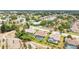 Suburban homes feature private pools, complemented by lush green lawns and mature trees in a vibrant neighborhood at 8804 Poe Dr, Hudson, FL 34667