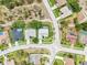 Aerial view of houses in a residential neighborhood with swimming pools and well-maintained lawns at 8804 Poe Dr, Hudson, FL 34667