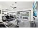 Inviting living room with sliding glass doors leading to an outdoor pool area, creating a seamless indoor-outdoor living space at 8804 Poe Dr, Hudson, FL 34667