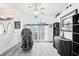 Bright living room with massage chair, large windows, and stylish decor create a relaxing space at 8804 Poe Dr, Hudson, FL 34667