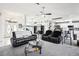 Spacious living room with an open floor plan, neutral decor, and a ceiling fan for added comfort at 8804 Poe Dr, Hudson, FL 34667