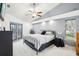 Comfortable bedroom with carpet, ceiling fan, and outdoor access, providing a serene retreat at 8804 Poe Dr, Hudson, FL 34667