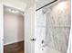Bathroom with tiled shower, tub, and walk-in closet at 9072 Baywood Park Dr, Seminole, FL 33777