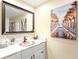 Bathroom with a copper sink, white marble vanity top, and a decorative mirror at 9072 Baywood Park Dr, Seminole, FL 33777
