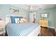 Inviting bedroom featuring a queen bed, ceiling fan, and stylish decor for a cozy ambiance at 9072 Baywood Park Dr, Seminole, FL 33777