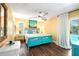 Cheery bedroom with wood floors, pool view, ceiling fan, and coastal decor for a relaxing atmosphere at 9072 Baywood Park Dr, Seminole, FL 33777