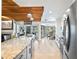 Modern kitchen with granite countertops, stainless steel appliances, and a bright open floorplan at 9072 Baywood Park Dr, Seminole, FL 33777