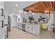 Open concept kitchen and living area with island, stainless appliances and modern decor at 9072 Baywood Park Dr, Seminole, FL 33777