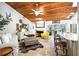 Comfortable and stylish living area with a fireplace, wet bar, and access to the outdoor patio at 9072 Baywood Park Dr, Seminole, FL 33777