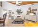 Bright living room featuring a wooden ceiling, tasteful decor, and comfortable seating at 9072 Baywood Park Dr, Seminole, FL 33777