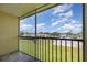 Screened in balcony overlooking well maintained landscaping and open parking at 942 Capri Isles Blvd # 207, Venice, FL 34292