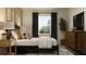 Tastefully furnished bedroom with wooden accents and lots of natural light at 9645 Runaway Breeze Dr, Land O Lakes, FL 34637